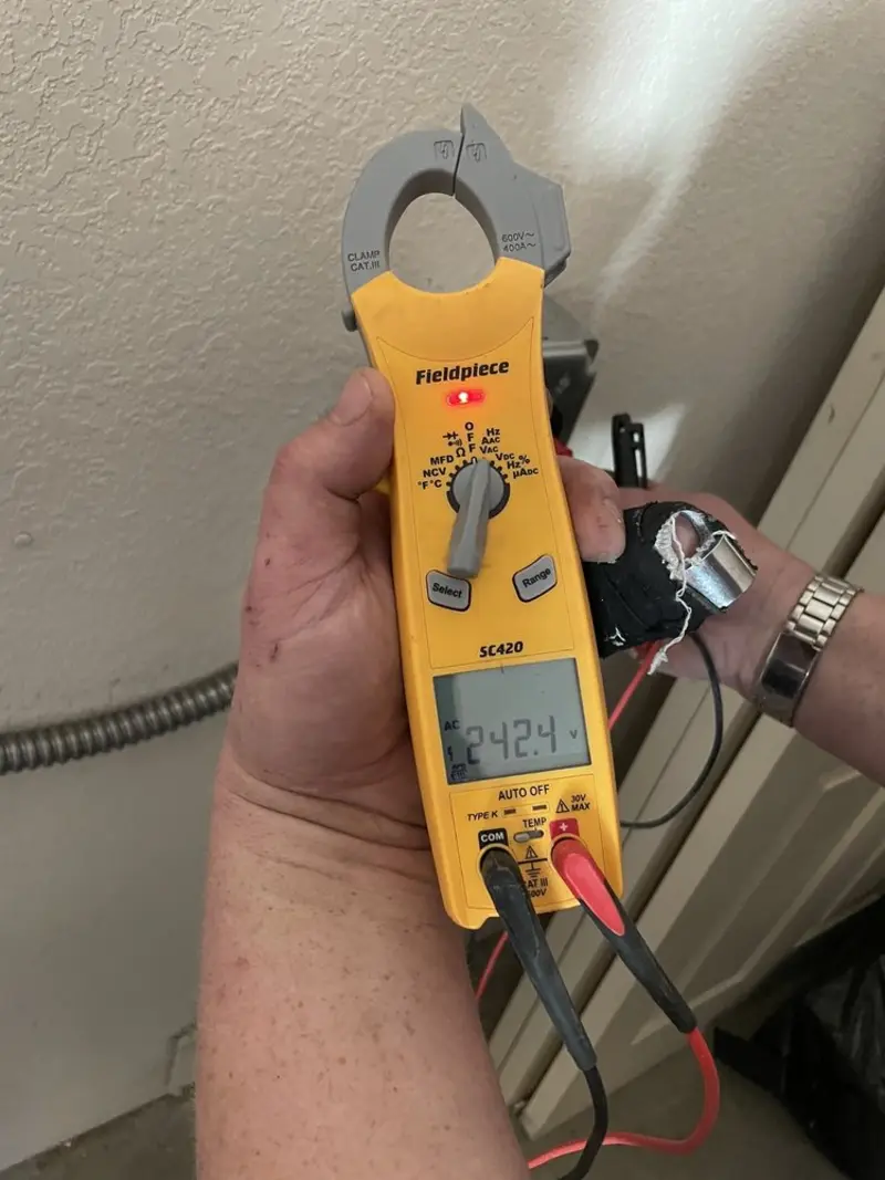 Voltage testing with clamp meter during Electrical Installation Services in Jamesburg